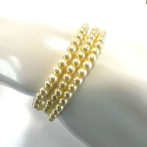 Triple strand faux pearl bracelet